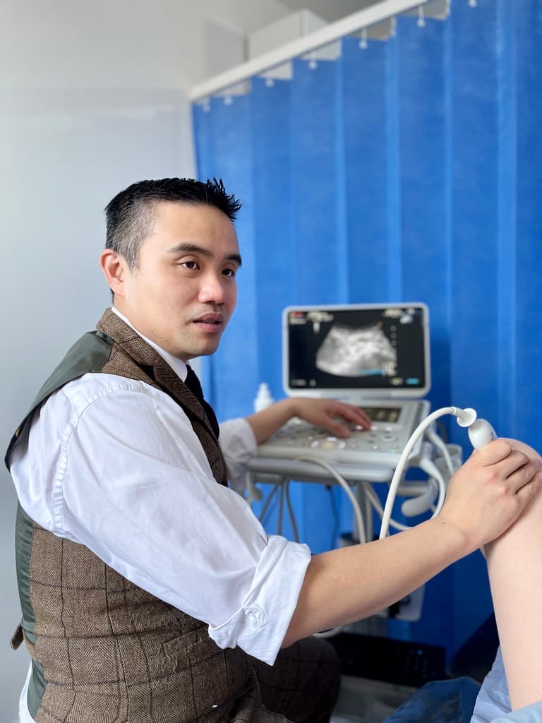 Professor Lee using ultrasound to assess a knee